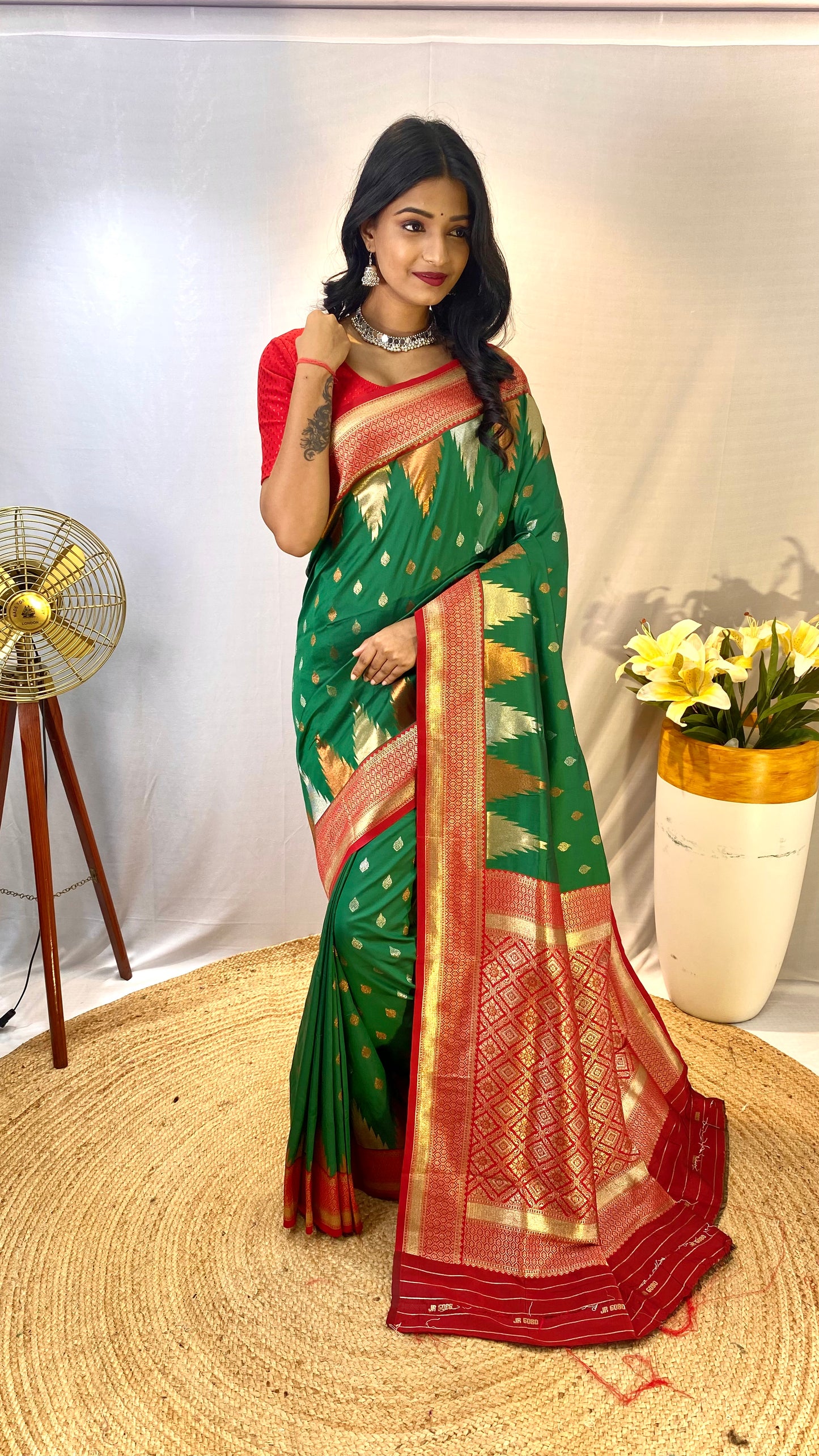 Bottel Green Kanchipuram sarees with a temple weaving border.