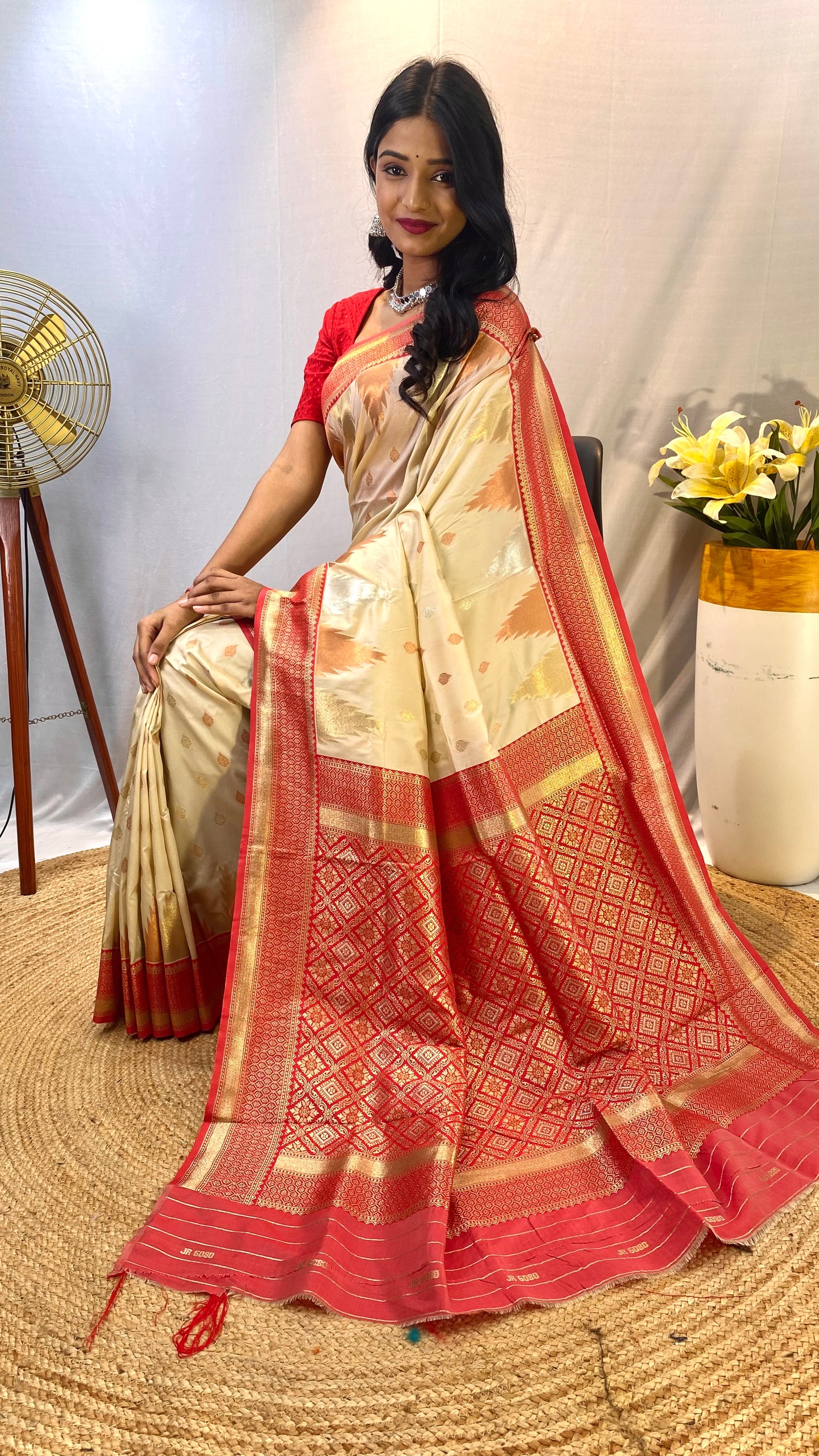 Cream 1 Kanchipuram sarees with a temple weaving border.