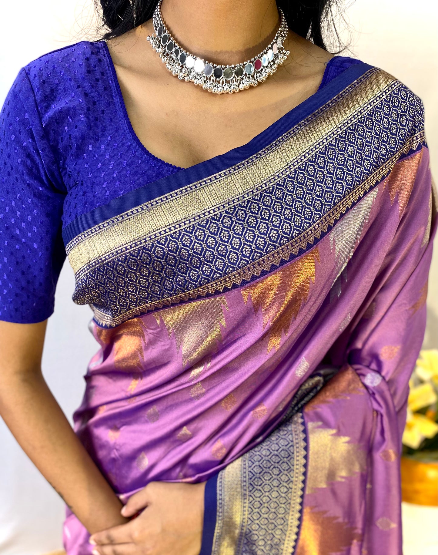 Lavendor Kanchipuram sarees with a temple weaving border.