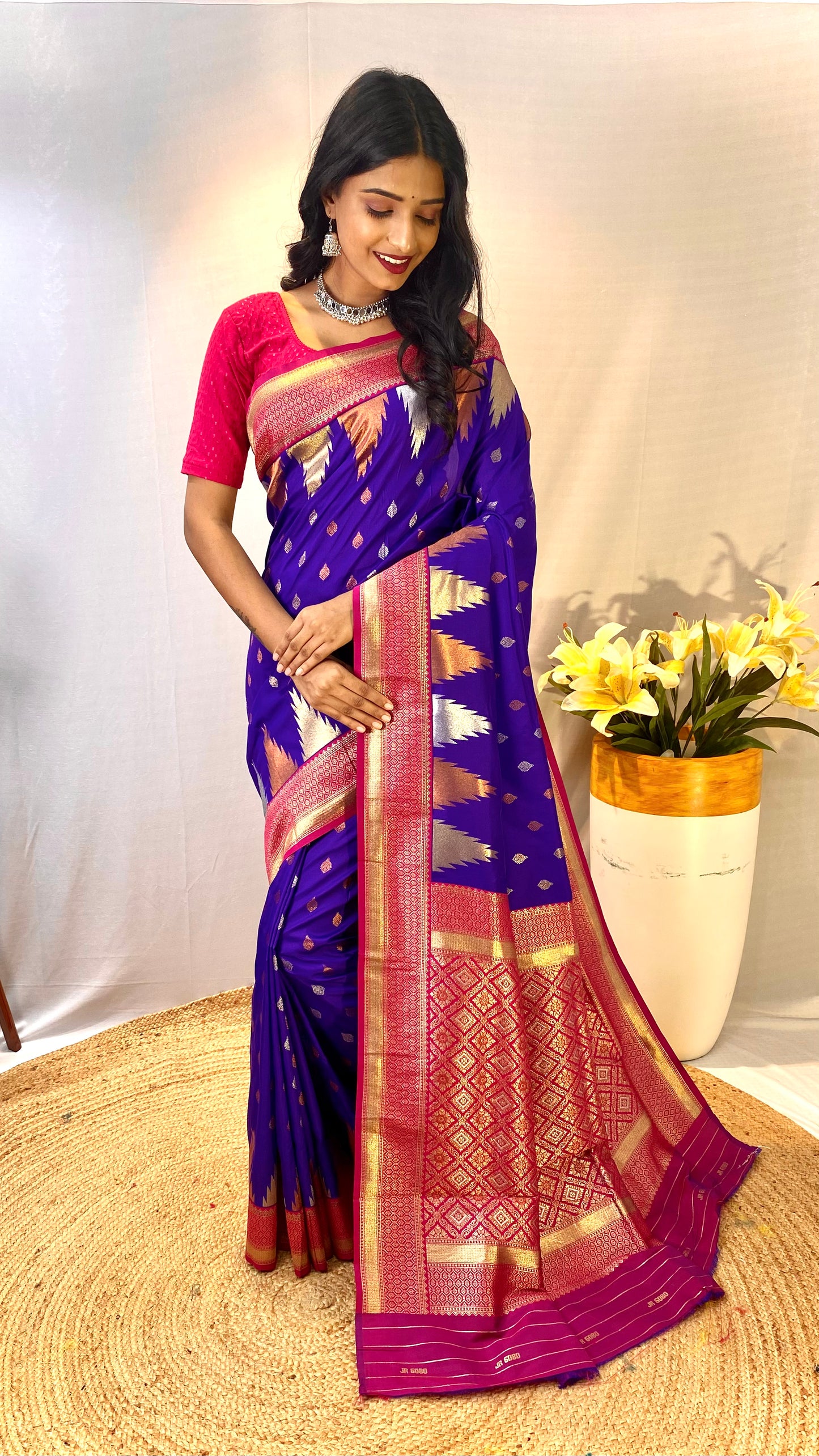 Violet Kanchipuram sarees with a temple weaving border.