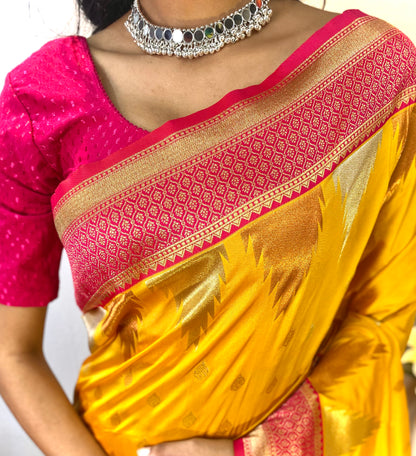 Yellow Kanchipuram sarees with a temple weaving border.