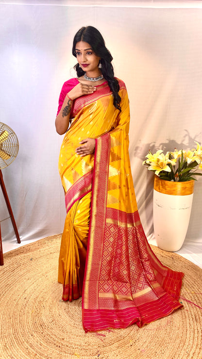 Yellow Kanchipuram sarees with a temple weaving border.